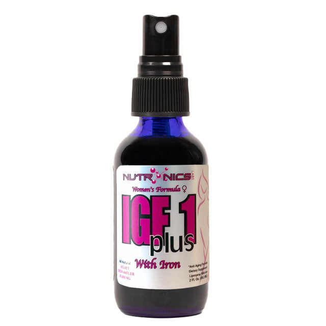 A small, dark blue spray bottle labeled IGF 1 plus with iron. The label features the brand name Nutronics at the top, along with the phrase Women's Formula. The label includes a pink graphic of a female silhouette and nutritional information, and the bottle has a black screw-on cap with a spray nozzle. The bottle is designed to be compact, approximately 2 ounces in size.